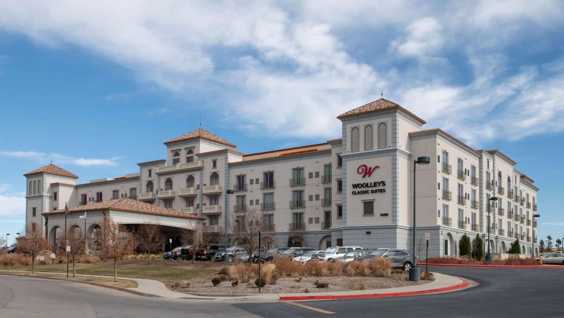 Woolley's Classic Suites exterior or lobby in Aurora, CO — main listing photo